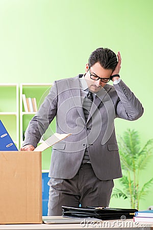 The male employee collecting his stuff after redundancy Stock Photo