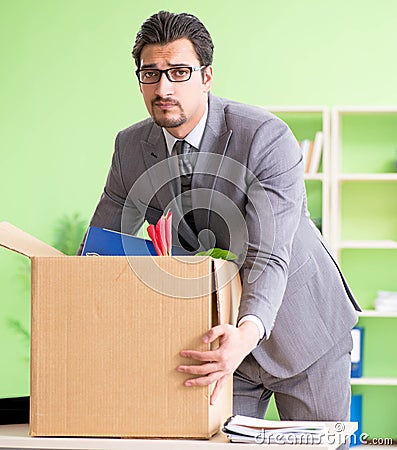 Male employee collecting his stuff after redundancy Stock Photo