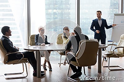 Male employee make presentation at friendly office meeting Stock Photo