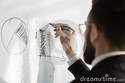 Male employee write on board develop business startup plan Stock Photo