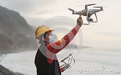 Male engineer doing inspection using drone Stock Photo