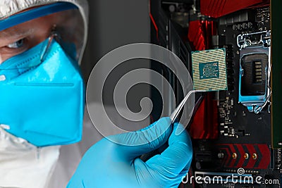 Male engineer install microprocessor in fast computer Stock Photo