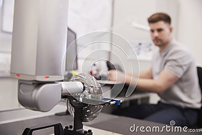 Male Engineer Uses CMM Coordinate Measuring Machine In Factory Stock Photo