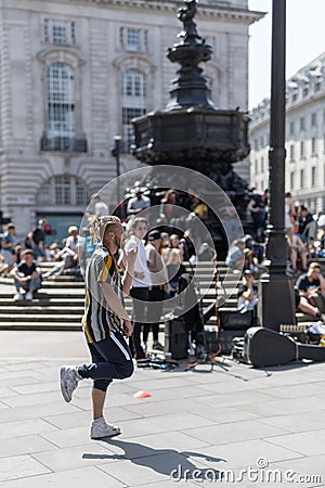 Male Entertainer, Street Artists in Piccadilly Circus Square,London Editorial Stock Photo