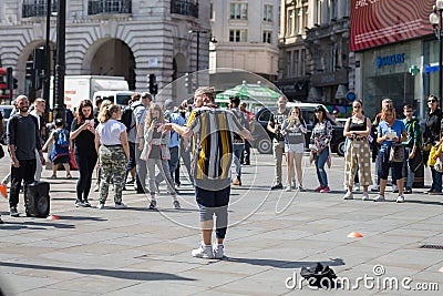 London, United Kingdom- June 2019: Male Entertainer, Street Artists in Piccadilly Circus Square,London Editorial Stock Photo