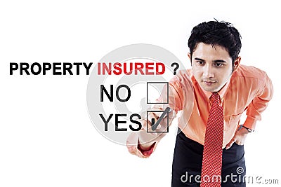 Male entrepreneur with text of property insured Stock Photo