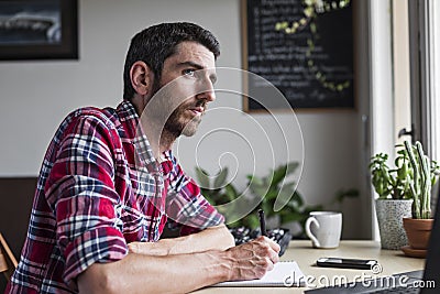 Male entrepreneur thinking about new business solutions Stock Photo
