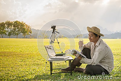 Male farmers are learning and planning to develop farms. Stock Photo