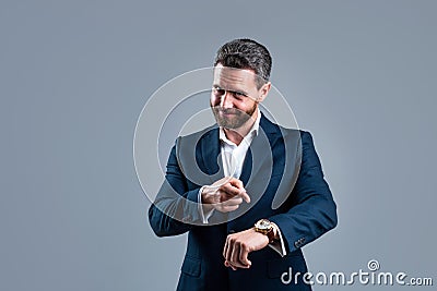 male fashion accessory. man in jacket on grey background. confident businessman with hand watch. need more time. modern Stock Photo