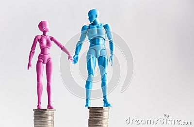 Male and female figurines holding hands looking at eachother, st Stock Photo