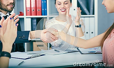 Male and female handshake in office. Partners made deal, sealed with handclasp. Stock Photo