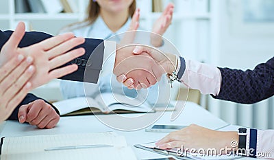 Male and female handshake in office. Stock Photo