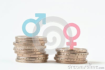 Male and female symbols on piles of coins - Gender pay equality Stock Photo