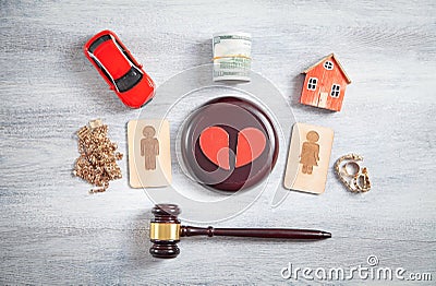 Male and female wooden symbols, gavel, house, car, broken heart and judge gavel Stock Photo
