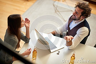 Male and female work colleagues casually hanging out Stock Photo