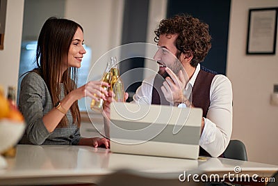 Male and female work colleagues casually hanging out after hours Stock Photo