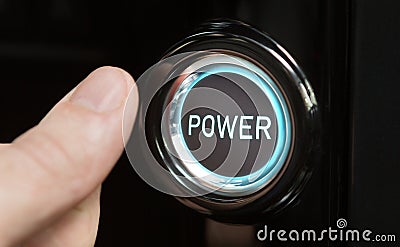 Male finger pushing button with text Power Stock Photo