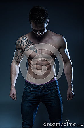 Male fitness model with the tattoo Stock Photo