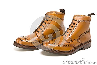 Male Footwear Ideas. Pair of Premium Tanned Brogue Derby Boots Stock Photo