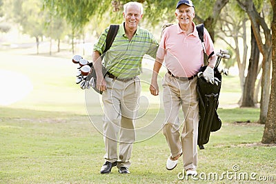 Male Friends Enjoying A Game Of Golf Stock Photo