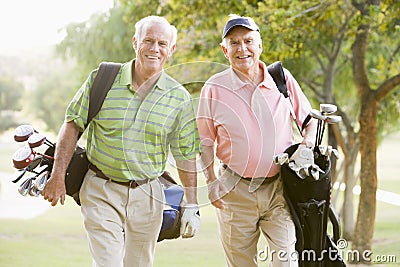 Male Friends Enjoying A Game Of Golf Stock Photo