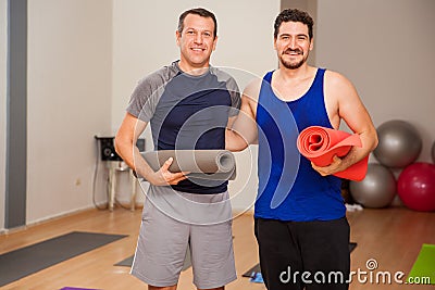 Male friends ready for yoga class Stock Photo