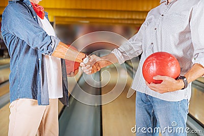 Close up of a handshake in a bowling club Stock Photo