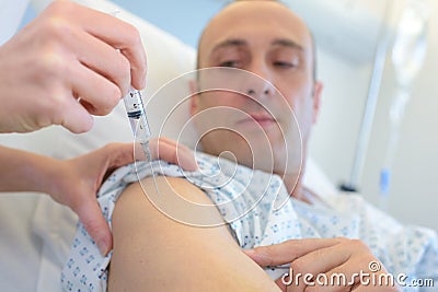 Male get injection on arm before blood donation Stock Photo