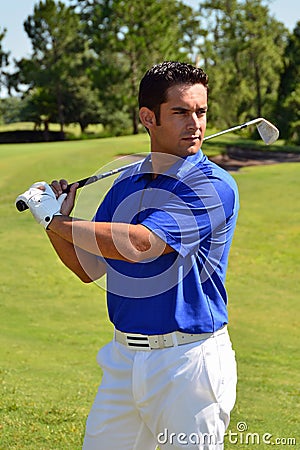 Male Golfer Poses With Golf Club Stock Photo