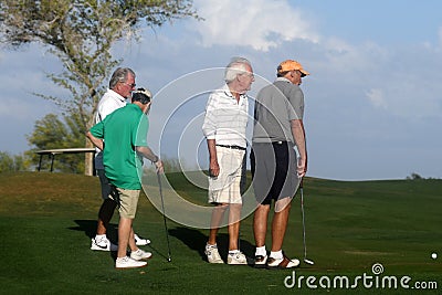 Male golfers on putting green. Editorial Stock Photo