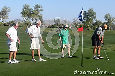 Male golfers on putting green. Editorial Stock Photo