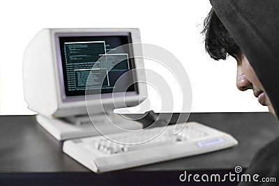 Male hacker sitting in front of computer Stock Photo