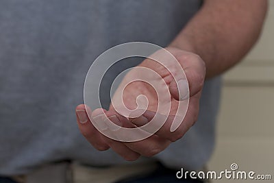 Male Left Hand Begging for Help Stock Photo