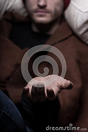 Male hand begging for money Stock Photo