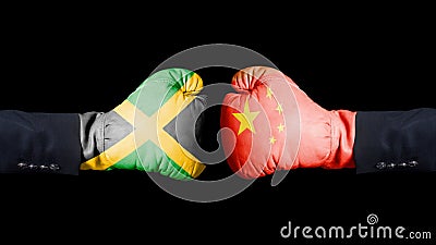 Male hand in Boxing gloves with Jamaica and China flags. Jamaica versus China concept. Stock Photo