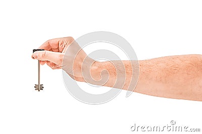 Male hand holding a key to the house, isolated over a white background. Stock Photo
