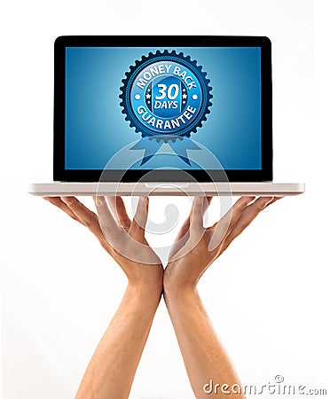 Male hand holding a laptop with Money back Label Stock Photo