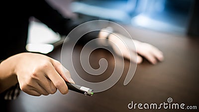 Male hand holding laser pointer in meeting room Stock Photo