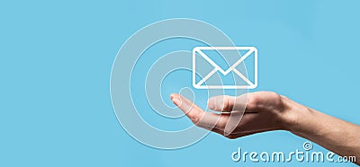 Male hand holding letter icon,email icons .Contact us by newsletter email and protect your personal information from spam mail. Stock Photo