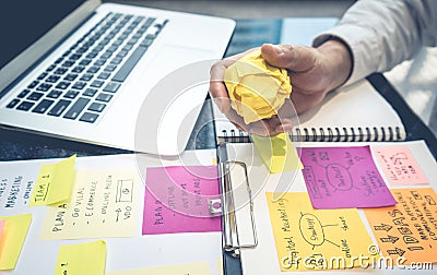 Male hand holding paper crumpled ball.business creativity Stock Photo