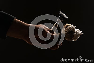 Male hand holding shaving equipment Stock Photo