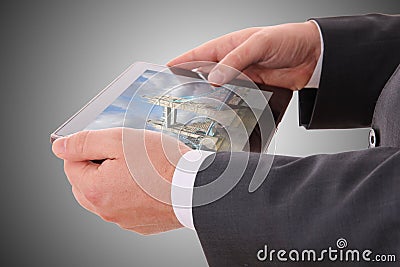 Male hand holding a tablet Stock Photo