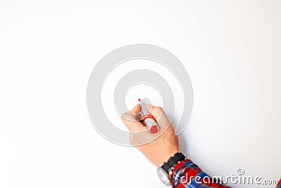 Male hand with a marker draws on a white board in the office. Stock Photo