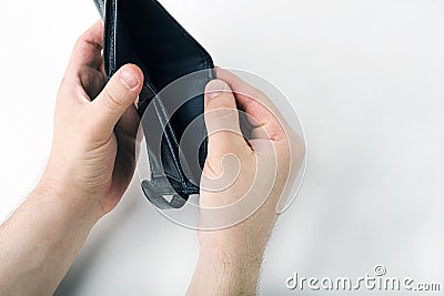 Male hand opening an empty wallet on white background. World economic crisis. Financial problem jobless, bankruptcy concept. Copy Stock Photo