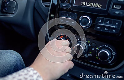 Male hand pressing button in modern car Stock Photo