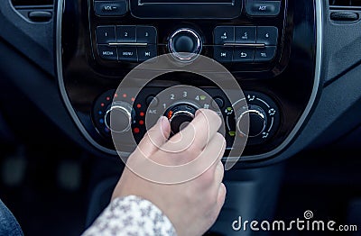 Male hand pressing button in modern car Stock Photo