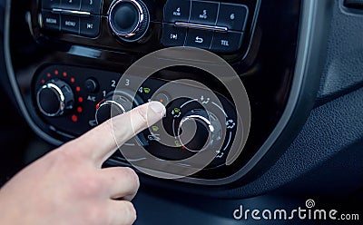 Male hand pressing button in modern car Stock Photo