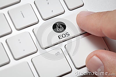 Male hand pressing computer key with EOS Editorial Stock Photo