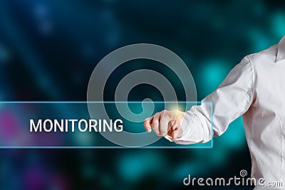 Male hand pressing the word monitoring on a virtual search display bar Stock Photo