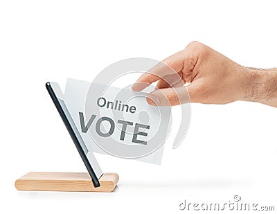 Male hand putting a ballot into a mobile phone, concept of online voting. Stock Photo